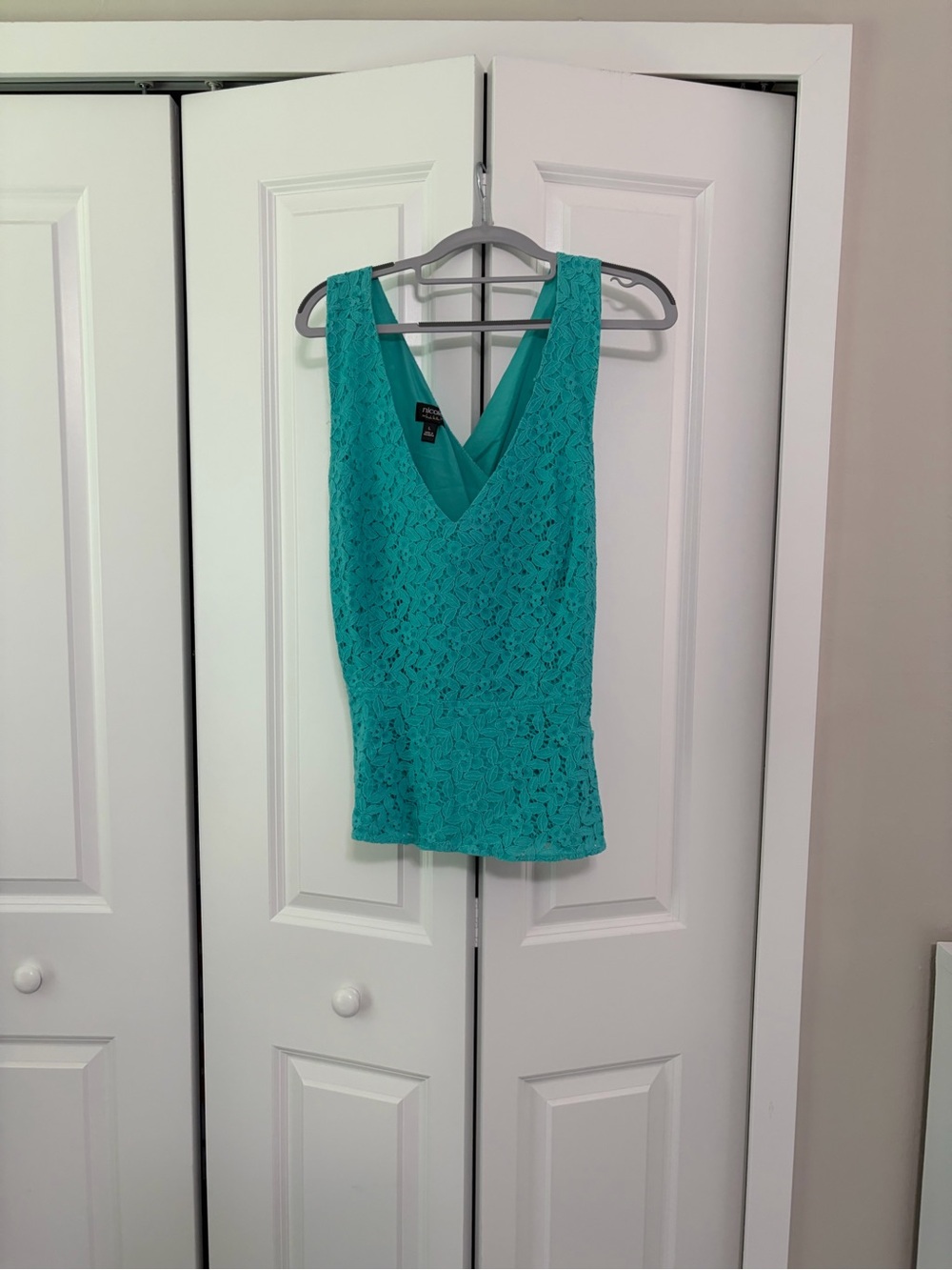 Nicole Miller Aqua blue crisscross top